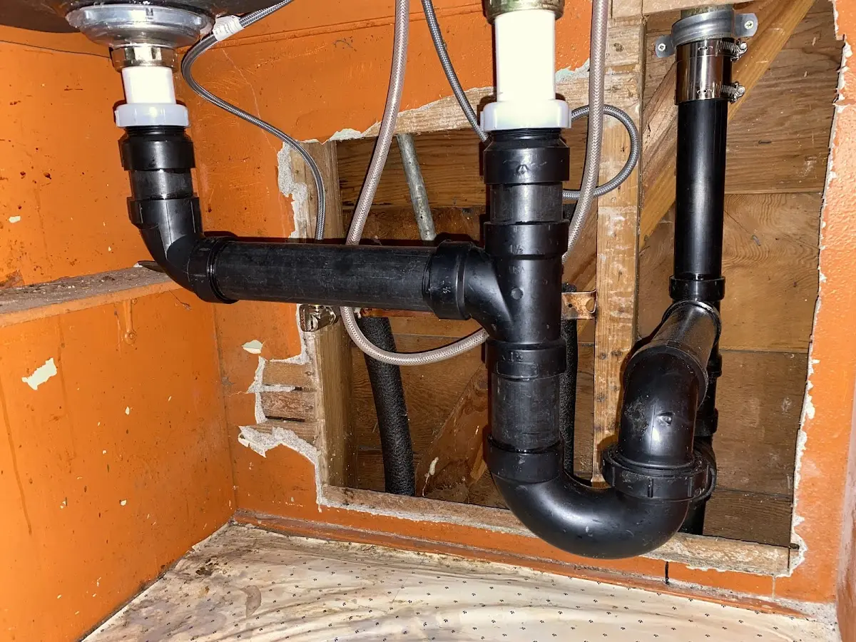 Professional Garbage Disposal Repair equipment and tools on the job in Two Rivers
